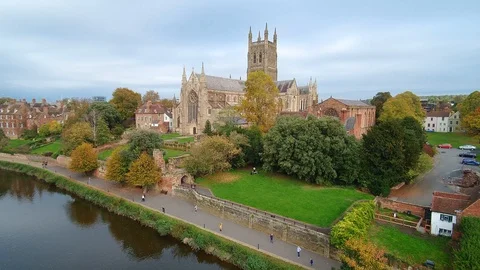Worcester Cathedral, ascending aerial view from over the River Severn Stock Footage