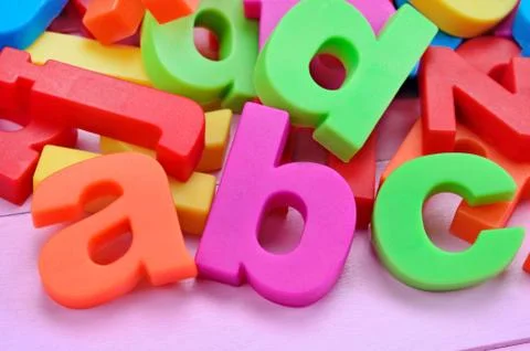 Word ABC on pink table Stock Photos