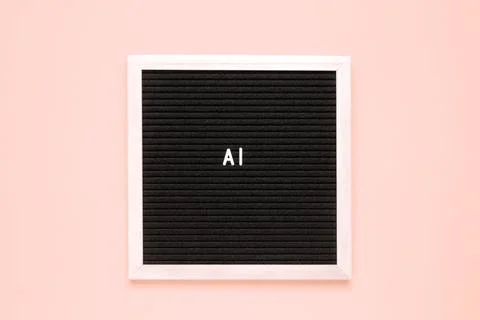 The word AI or Artificial Intelligence on black letter board over isolated .. Stock Photos