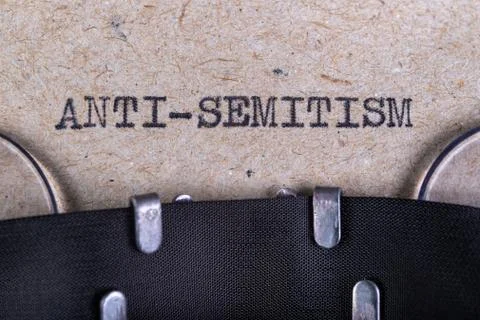 The word anti-semitism written in typewriter font. The inscription in the old Stock Photos