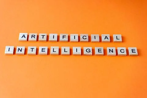Word artificial intelligence. The phrase AI is laid out in wooden letters top Stock Photos