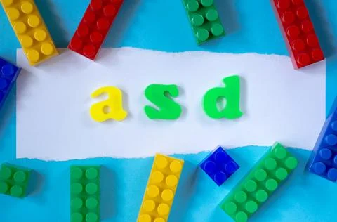 The word ASD from color letters with elements of a child's constructor. Stock Photos