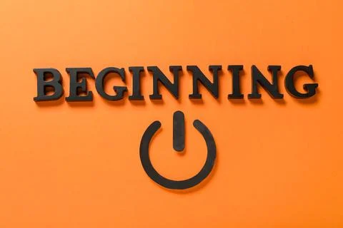Word BEGINNING with power button on orange background Stock Photos
