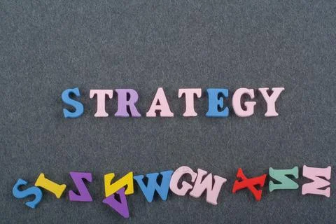 Word on black board background composed from colorful abc alphabet block wood Stock Photos