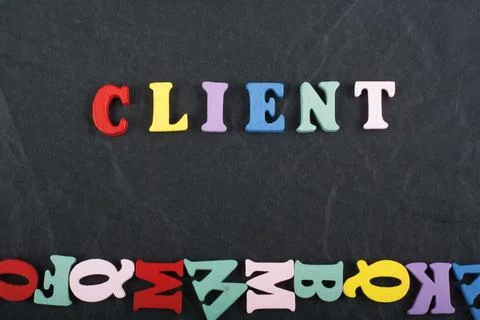 Word on black board background composed from colorful abc alphabet block wood Foto stock