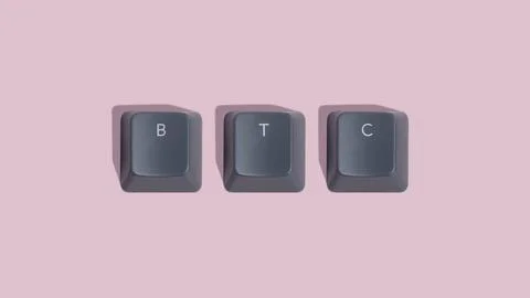 The word BTC is laid out from gray keyboard keycaps on pink background Stock Photos