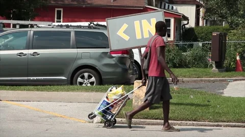 In word caption text writing sign in yellow on gray background on post on grass Stock Footage 252043798
