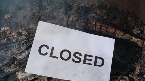 Word Closed on a white sheet of paper burns into a fire against. Slow motion Vídeo Stock 141810073