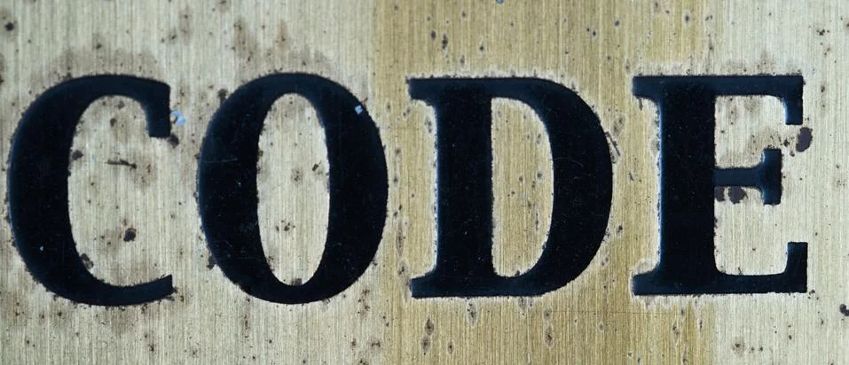 Word "code" in black letters Stock Photos