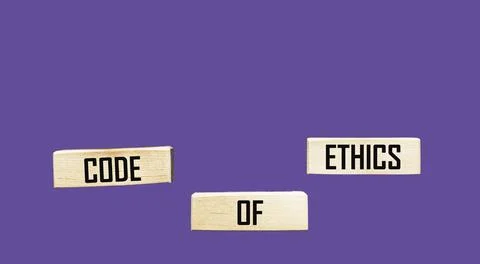The word code of ethics is written on a wooden block on a beautiful backgroun Stock Photos