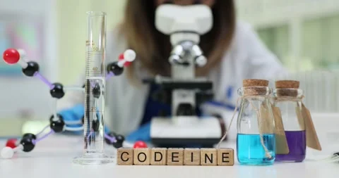 Word Codeine of cubes and glassware near molecular structure Stock Footage 310220977