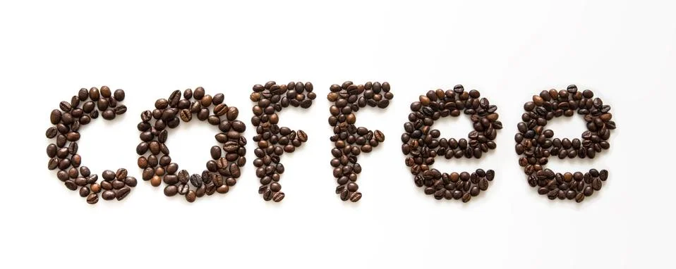 Word coffee with coffee beans on white background Stock Photos
