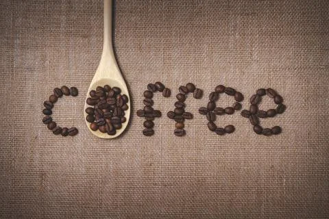 The word coffee is written in beans. Stock Photos