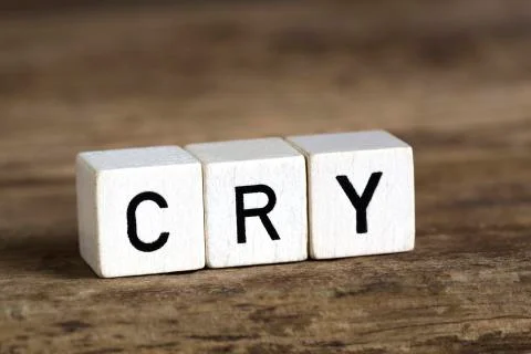 The word cry written in cubes Stock Photos