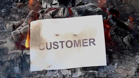Word Customer on a white sheet of paper burns into a fire against. Vídeo Stock 141503246