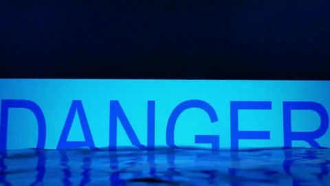 The word 'DANGER' covered by the water level Stock Footage 80809412