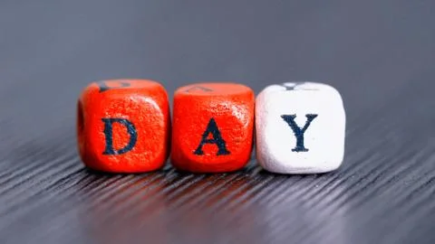 The word day on colored cubes Stock Photos