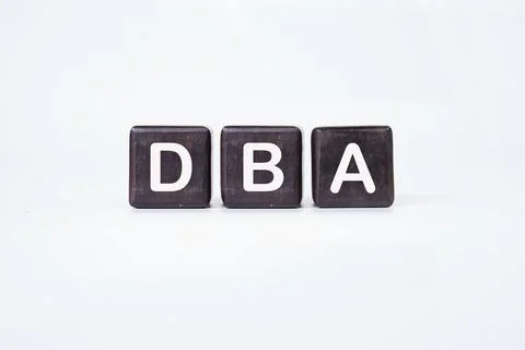 Word DBA (Database administrator) on cubes on a white background. Stock Photos