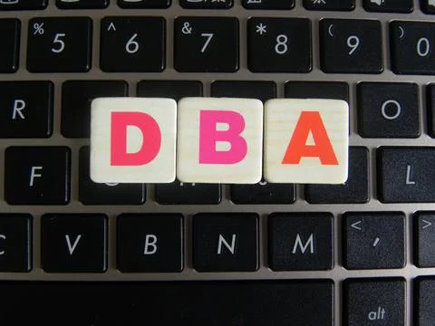 Word DBA (Database administrator) on keyboard background Stock Photos