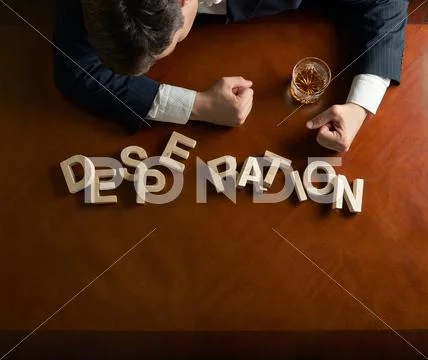 Word Desperation and devastated man composition Stock Photos
