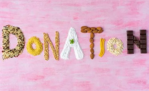 The word donation made of different type of groats. Copy space Stock Photos