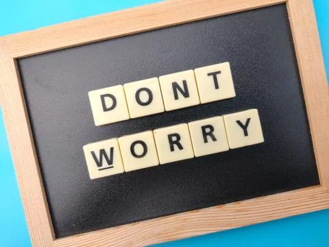 The word DONT WORRY on blue background. Stock Photos