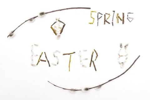 The word Easter and Spring is lined with flowering stems. Spring card for the Stock Photos