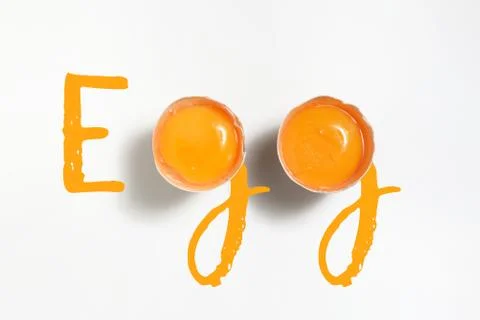 Word Egg Written With 2 Egg Yolks Stock Photos