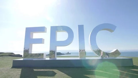 The word Epic as an art installation next to beach Stock Footage 73559954