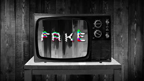 Word FAKE write with glitch 3d interferences bad signal on retro television set Stock Footage 119436469