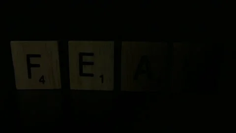 The Word FEAR Dramatic Light Passing Over It 库存影片 131107243