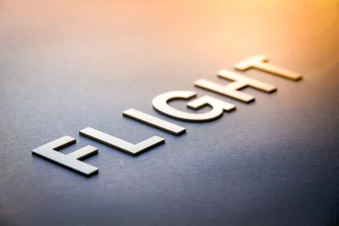 Word flight written with white solid letters 스톡 사진