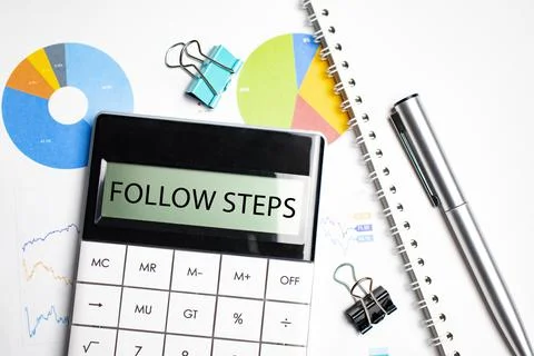 Word Follow these steps statement on the calculator. Business and tax concept Stock Photos