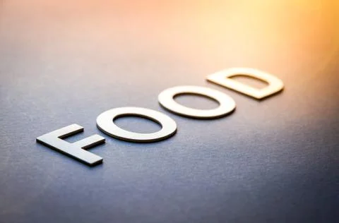 Word food written with white solid letters Stock Photos