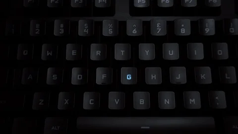 The word gender is typed on a luminous computer keyboard. Black backlit keyboard Stock Footage 118276719