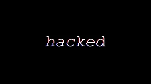 The Word 'HACKED' Text Animation with Glitch Effect on Black Background, 4K Stock Footage 282187402
