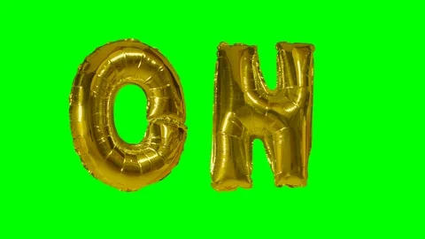 Word on from helium gold balloon letters floating on green screen Stock Footage 104706953