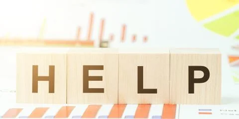 Word help with cubes on table with different color graphs 写真素材