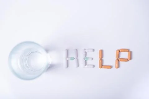 Word HELP formed with pills. Stock Photos