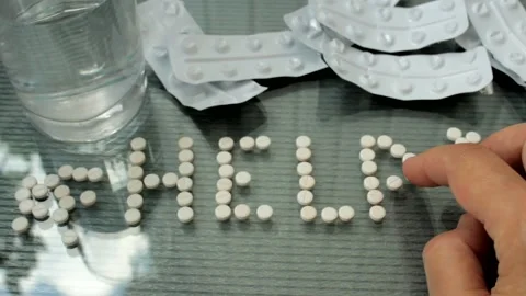 The word Help from the pills. Overdose and suicide concept, suicide help. Stock Footage 205093205