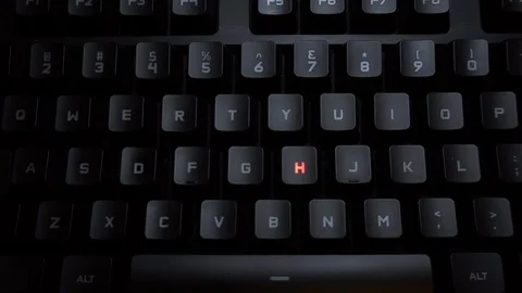 The word help is typed on a luminous computer keyboard. Black backlit keyboard Stock Footage 118276847