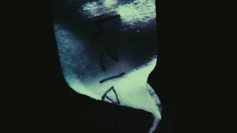 The Word 'Help' Written on Paper Sinking and Dissolving Stock Footage 300886642