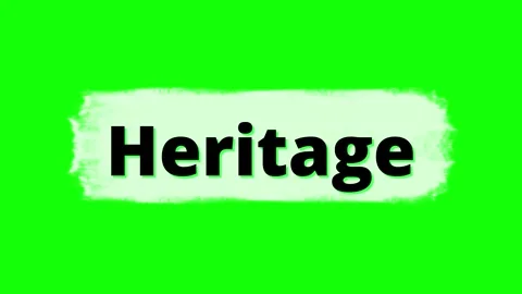 Word Heritage written in black bold typography on a white brush stroke against Stock Footage 345635289
