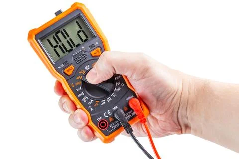 The word hold on screen of digital electrical multimeter in right hand, iso.. Stock Photos