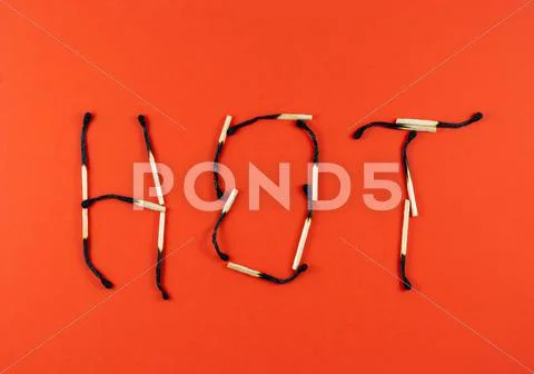 Word hot made of matchsticks Stock Photos