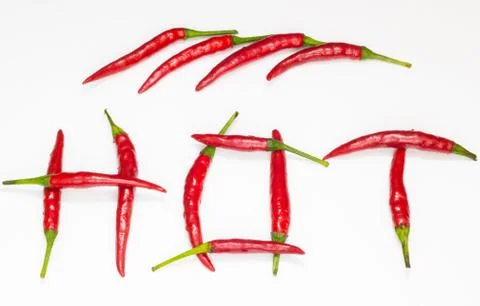 The word hot made from red chili peppers on a white background Stock-Fotos