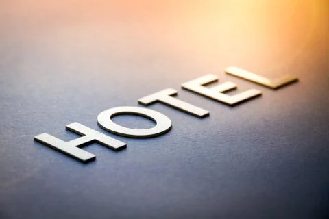 Word hotel written with white solid letters Illustrazione stock