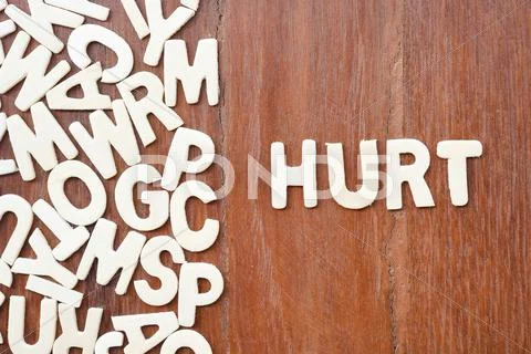 Word hurt made with block wooden letters Stock Photos