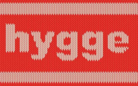 Word HYGGE on knitting texture Stock Illustration