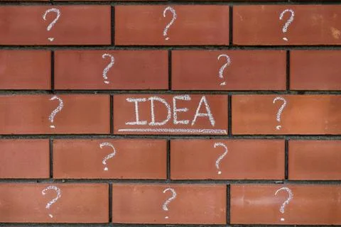 Word Idea and question marks drawn on bricks Stock Photos